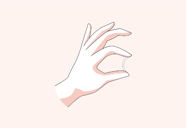 Nexplanon device, held up by a hand