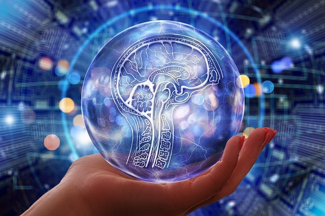 Image of a hand holding a circle with the drawing of a human brain inside of the circle, a graphic interpretation of artificial intelligence