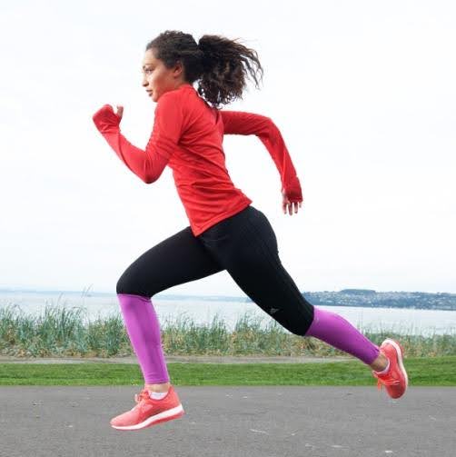 Woman running, wearing running clothing